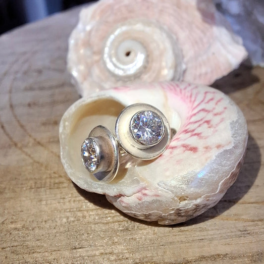 Silver glittery cubic zirconia earring studs by Shelley Ide Jewellery, featuring sparkling cubic zirconia stones on sleek silver backing.