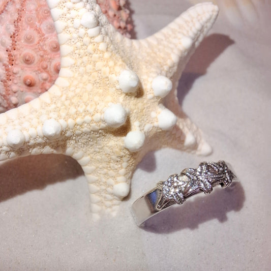 Silver ring featuring delicate silver starfish