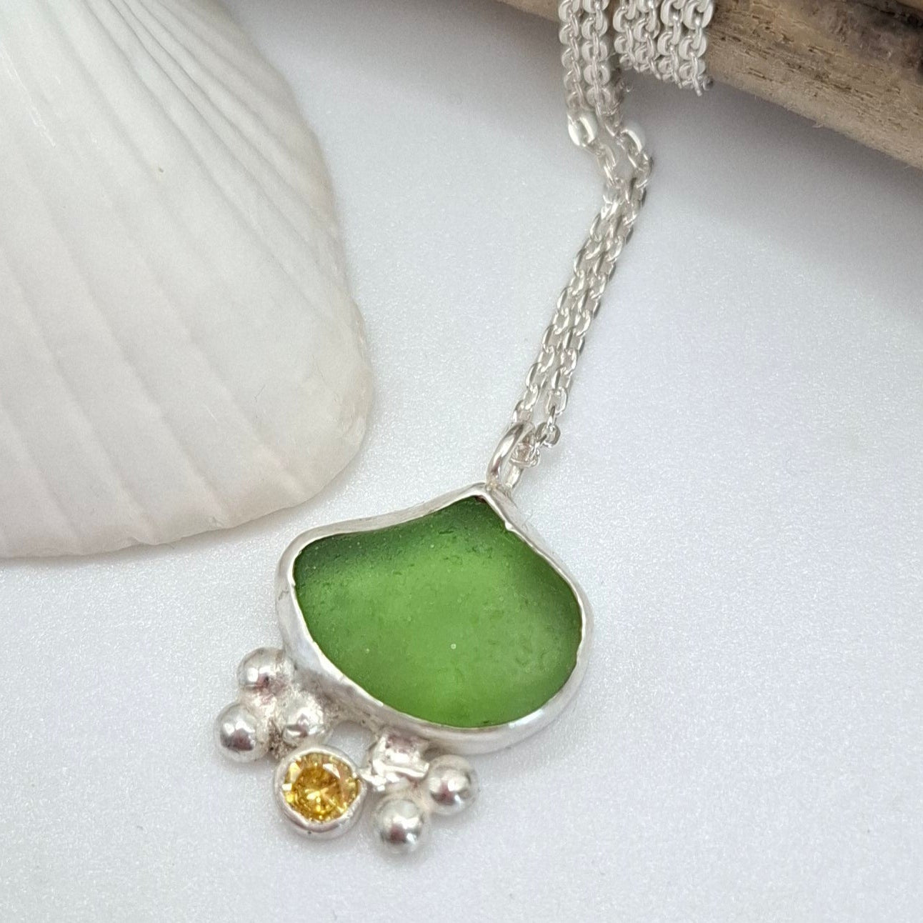 Dinky green seaglass pendant with yellow cubic zirconia
