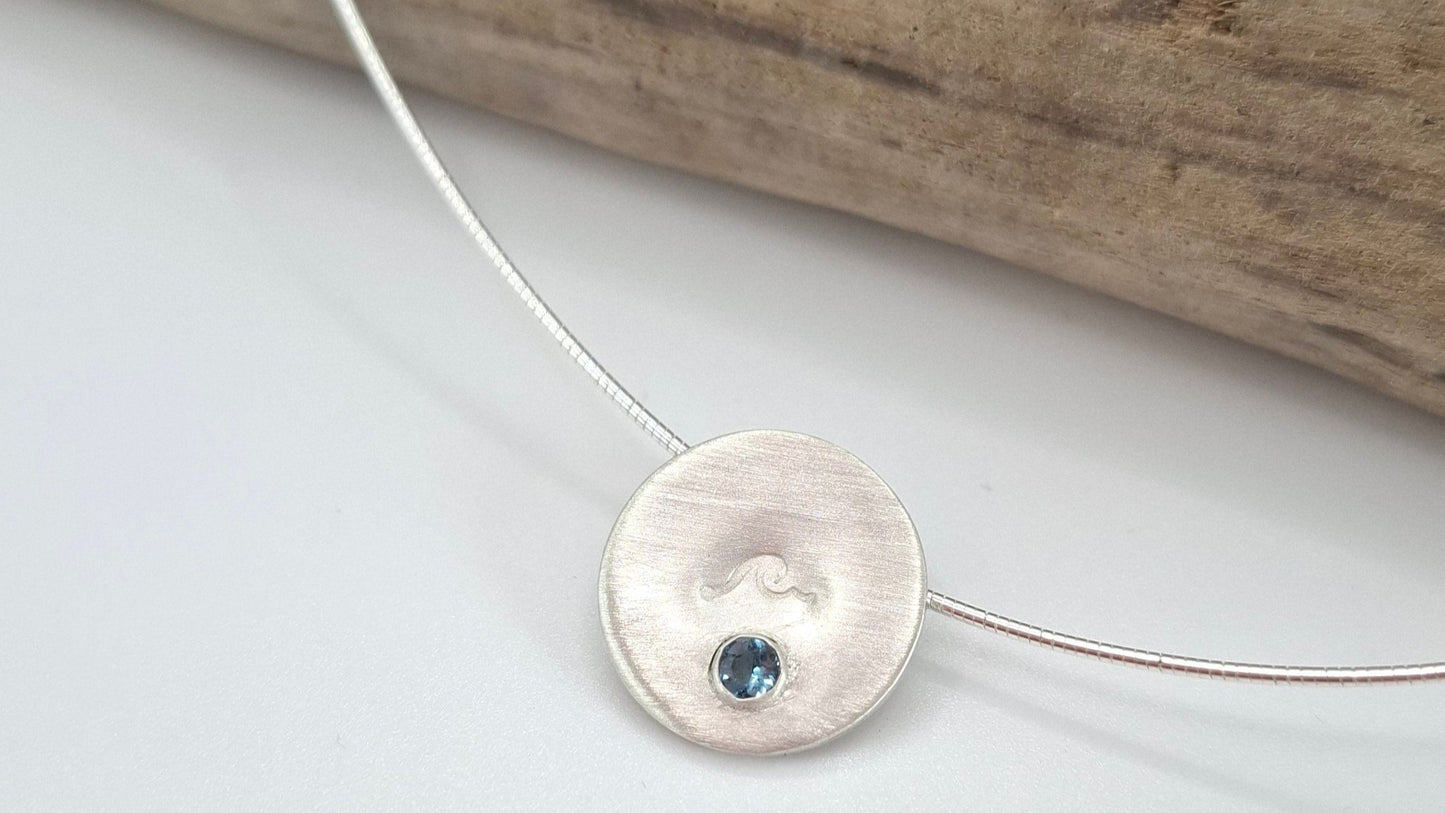 Silver wave pendant with Swiss Topaz