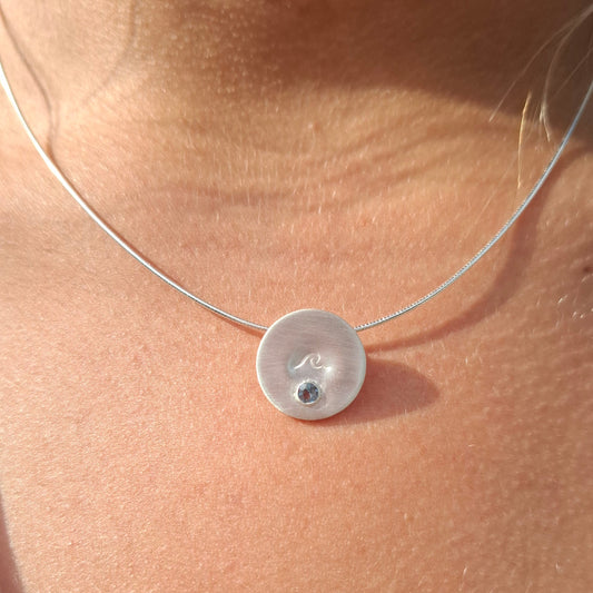 Silver wave pendant with Swiss Topaz