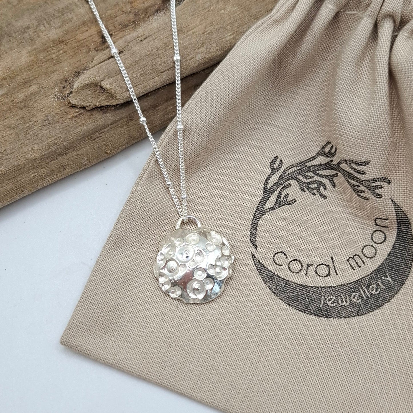 Silver moon pendant.
