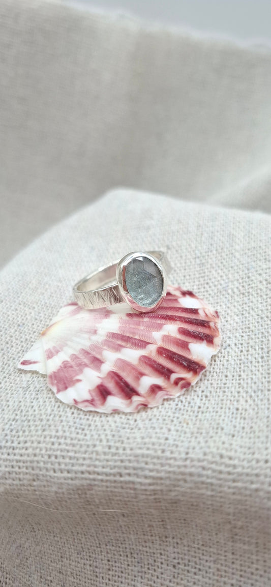 Hammered textured silver ring featuring a rose cut aquamarine