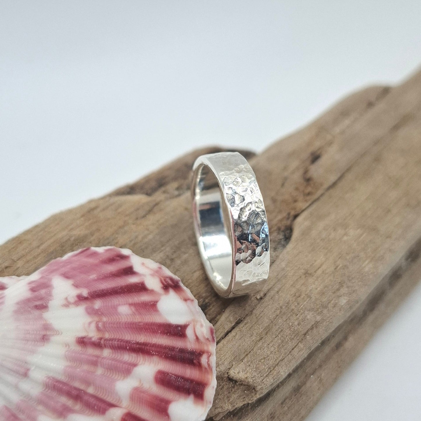 Hammered textured sterling silver ring from Shelley Ide Jewellery, showcasing a stylish, handcrafted design on a plain background.