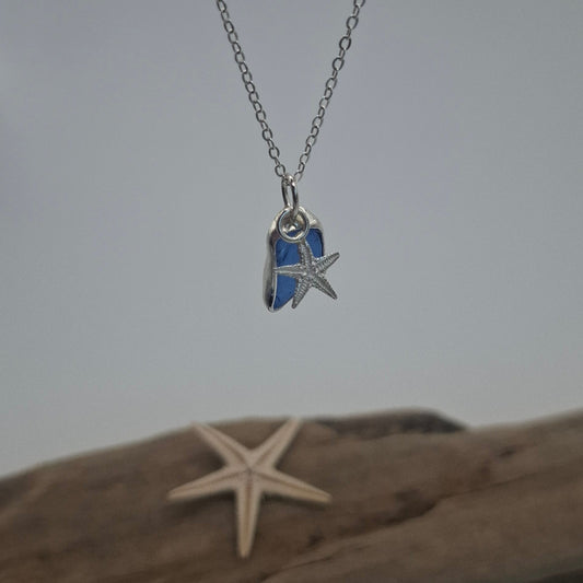 Small royal blue seaglass pendant with silver starfish charm on necklace, by Shelley Ide Jewellery.