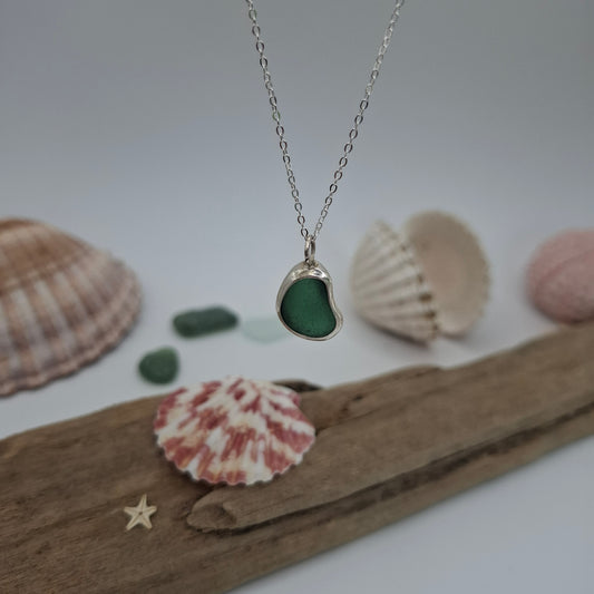 Teal green bean-shaped seaglass pendant on necklace by Shelley Ide Jewellery, showcasing a chunky Channel Islands-inspired design.