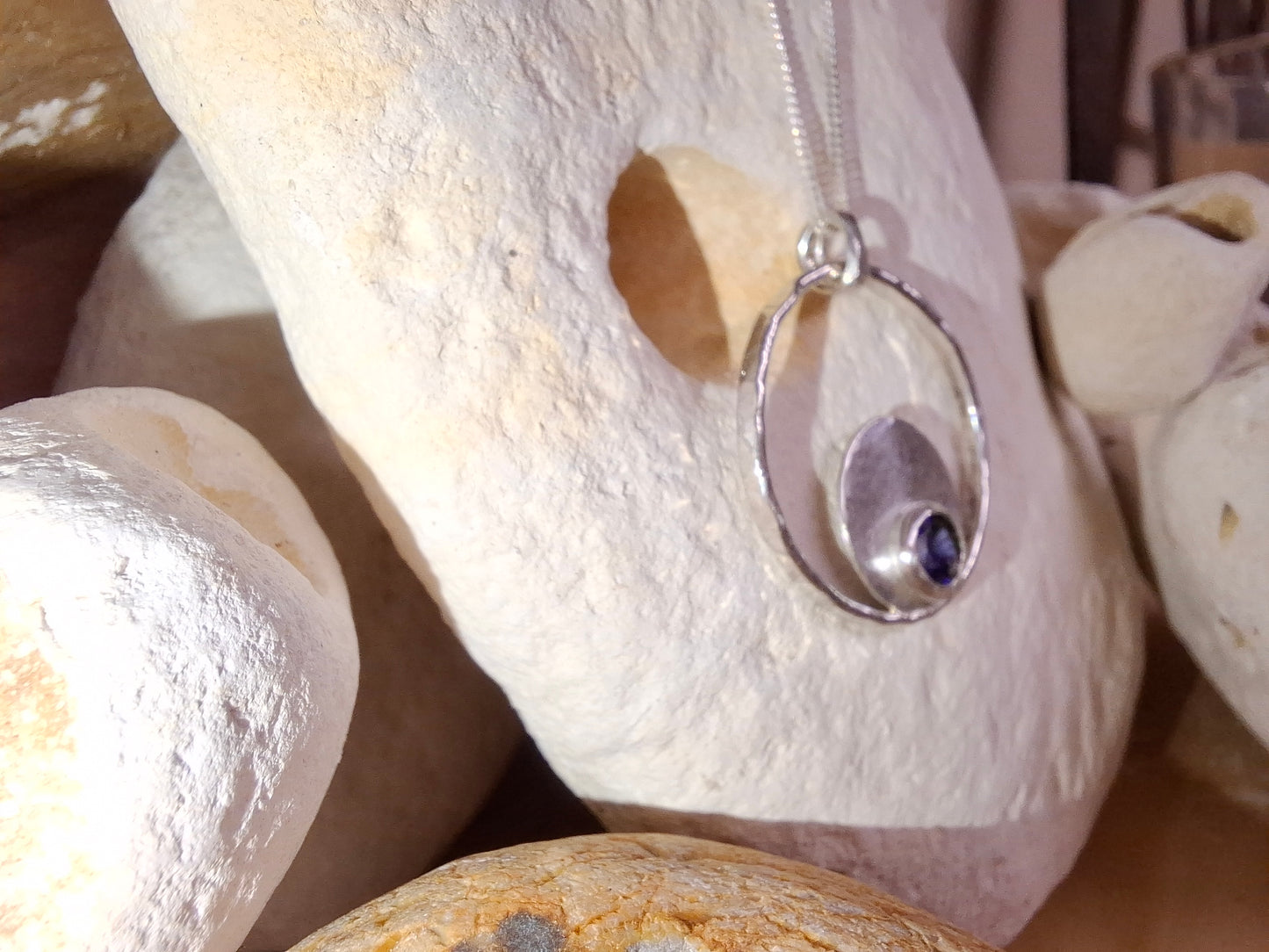 Silver hammered bubbles pendant with tanzanite coloured cubic zirconia and necklace