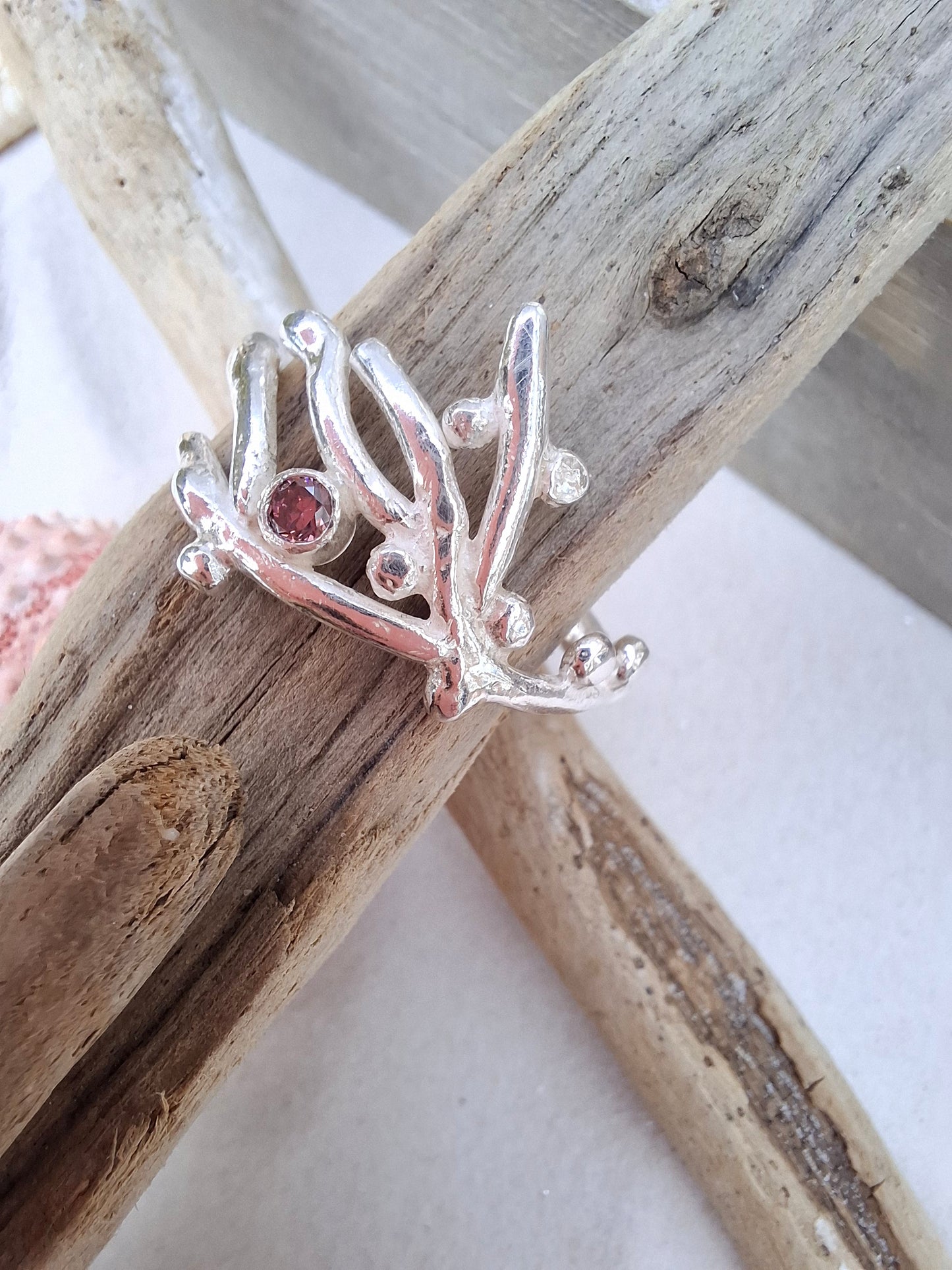 Coral inspired silver ring with a rhodolite pink cubic zirconia