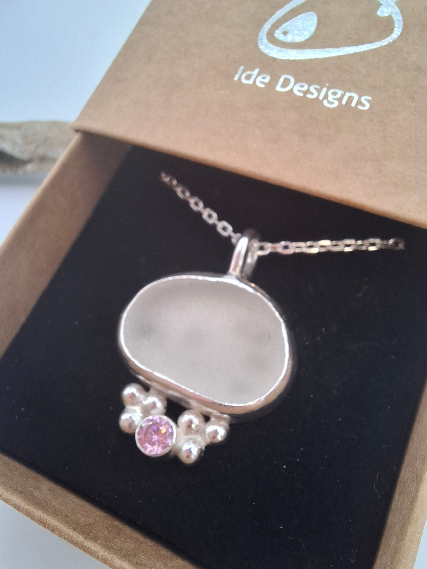 White/clear seaglass pendant with pink cubic zirconia