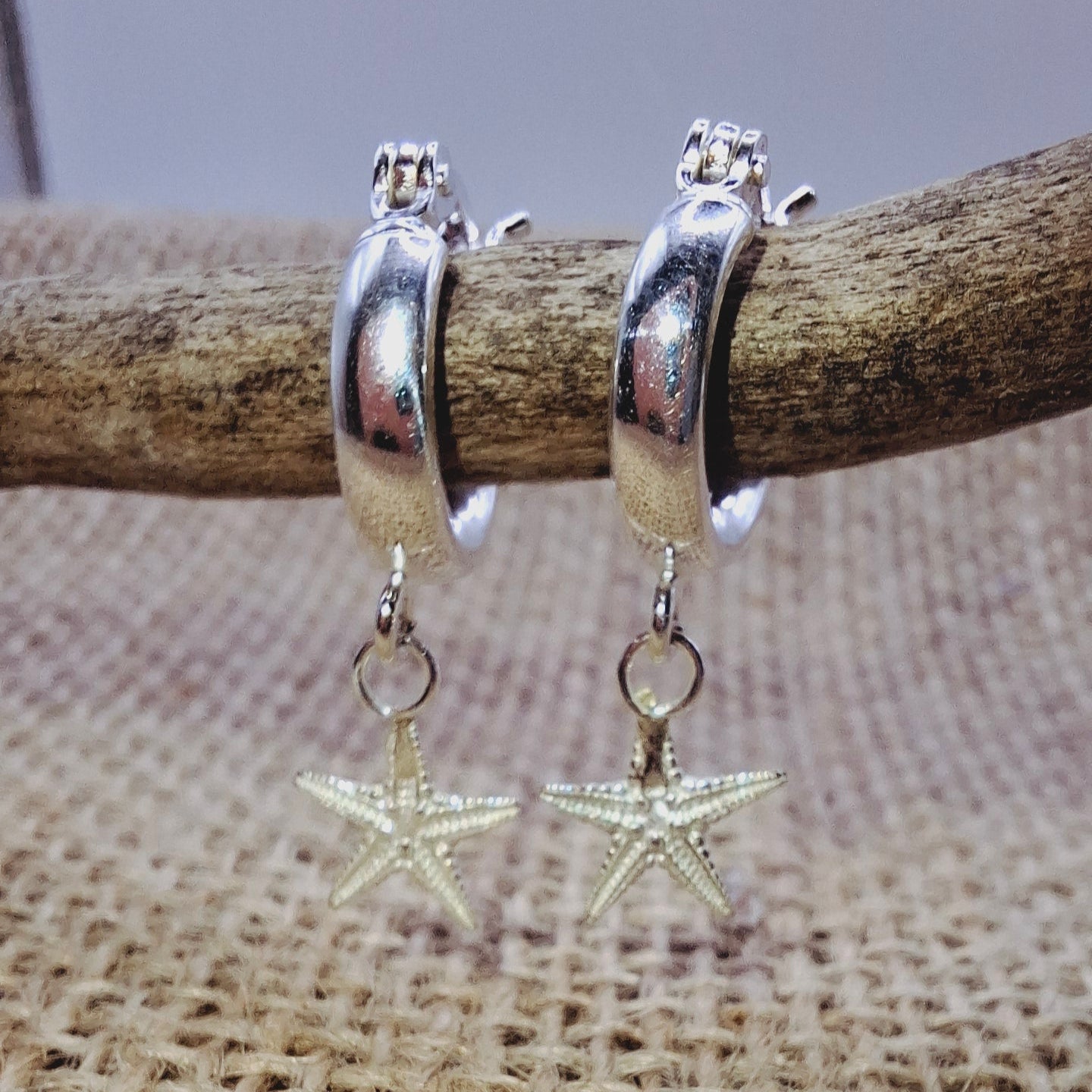 Dinky cast silver starfish on silver huggie hoop