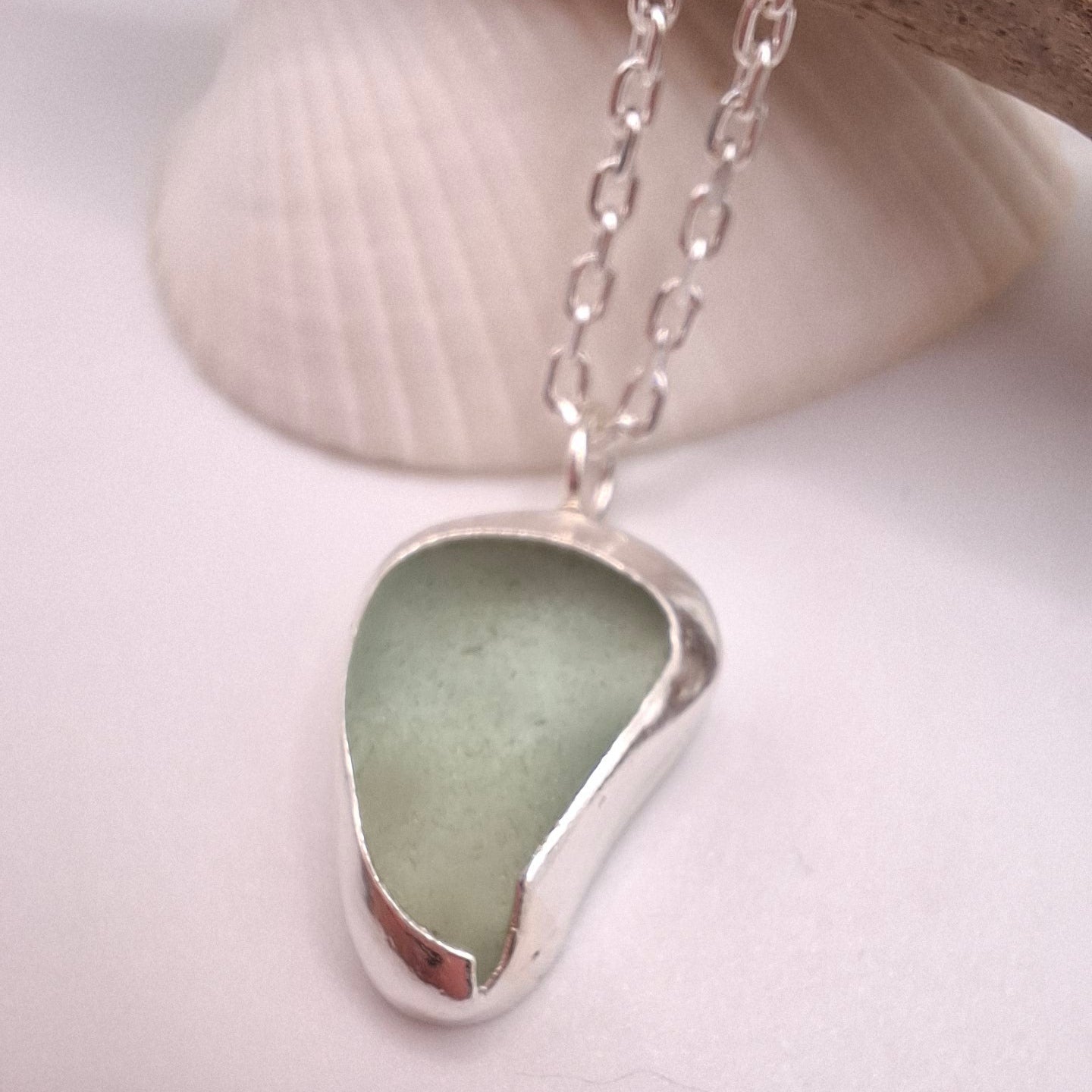 Teardrop shaped pale green seaglass pendant
