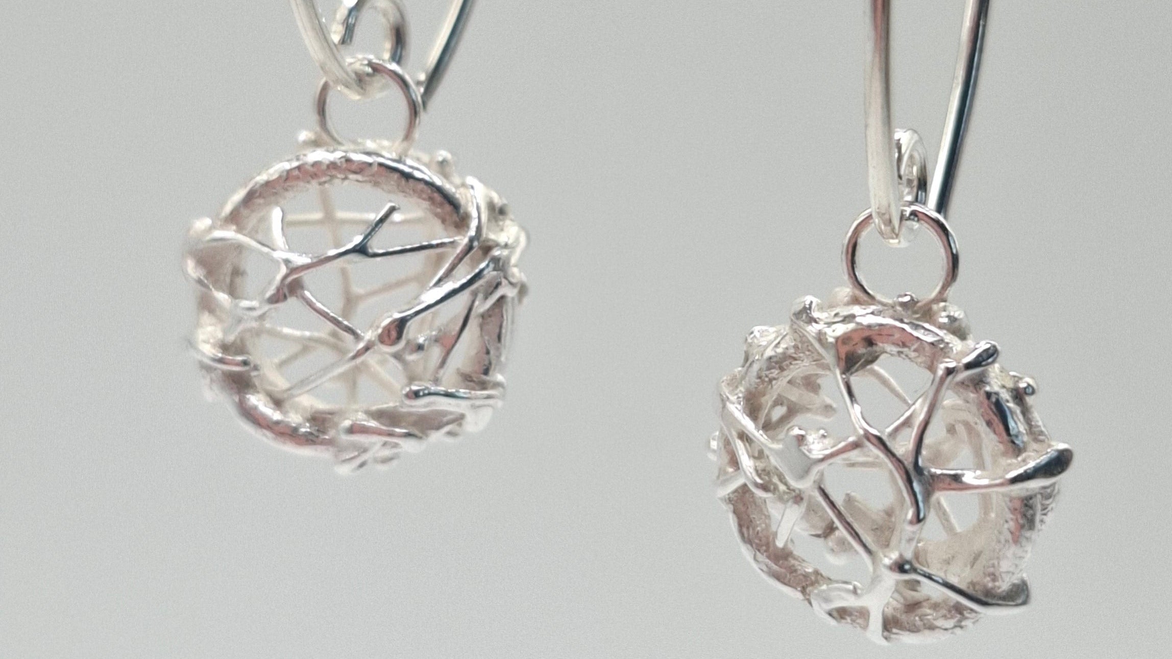 Silver tangled fishing net statement earrings by Shelley Ide Jewellery, featuring intricate, net-like design.