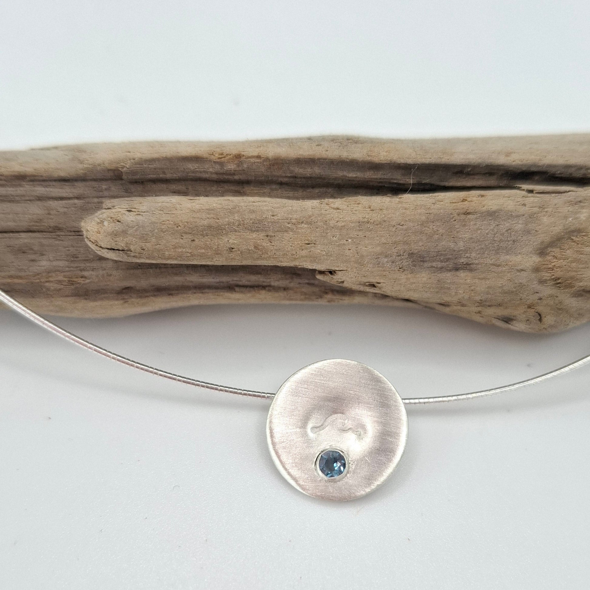 Silver wave pendant with Swiss Topaz