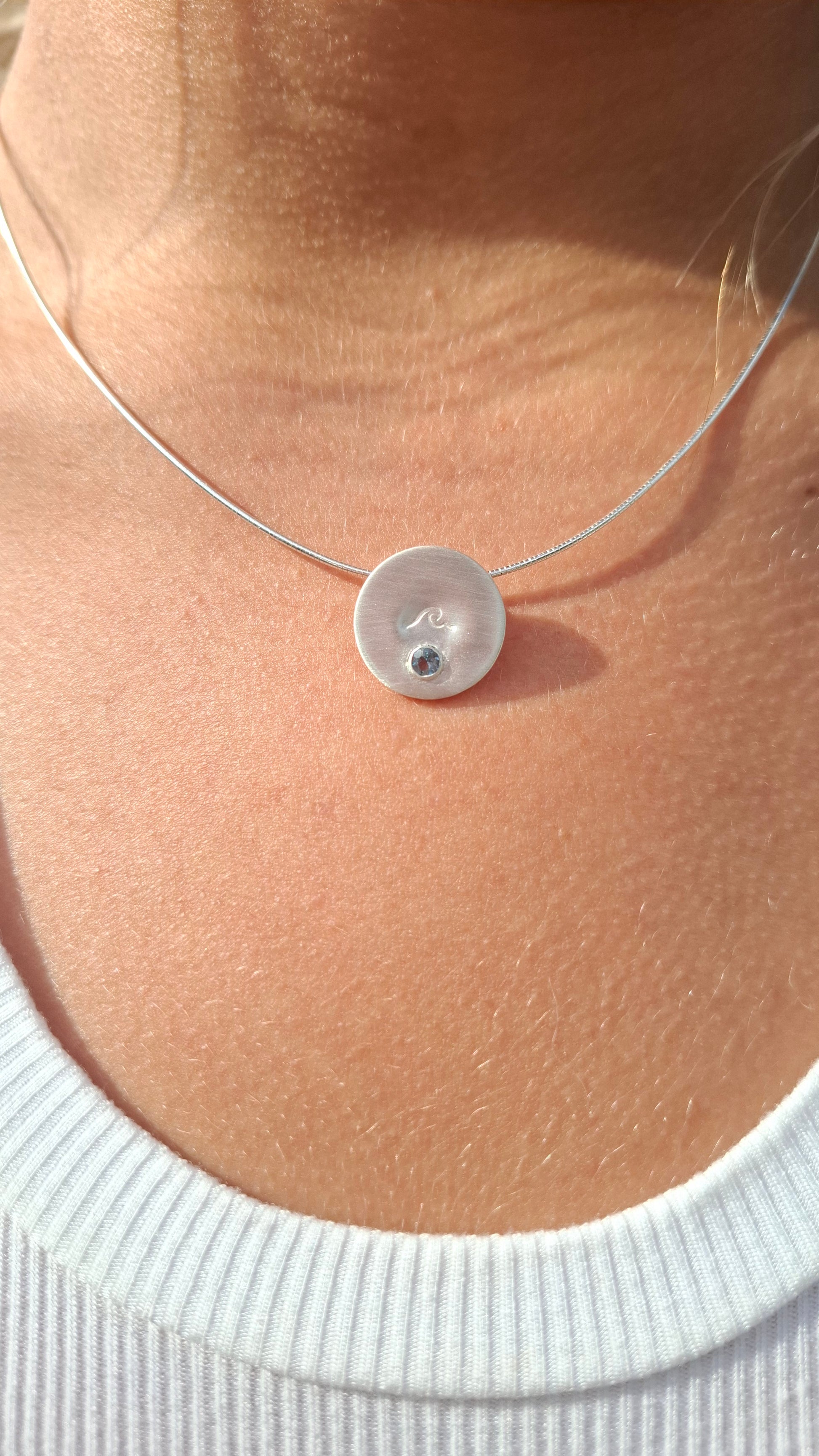 Silver wave pendant with Swiss Topaz