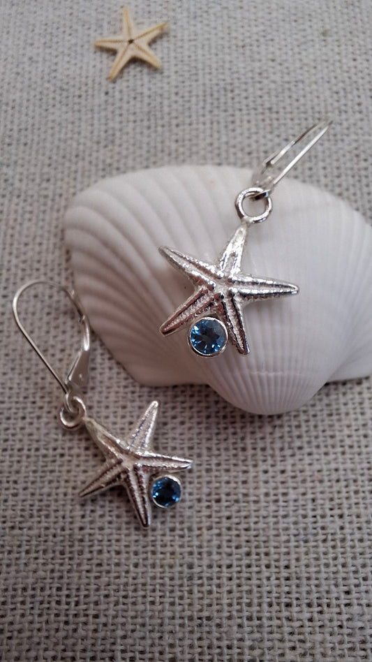 Cast silver starfish dangly earrings with swiss topaz