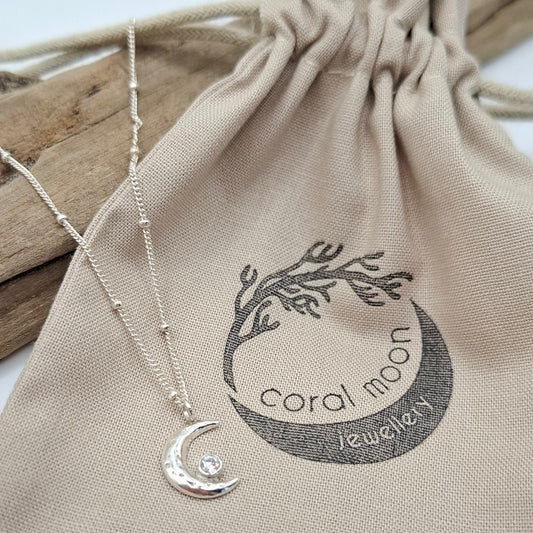 Handmade waning silver moon pendant with birthstone.