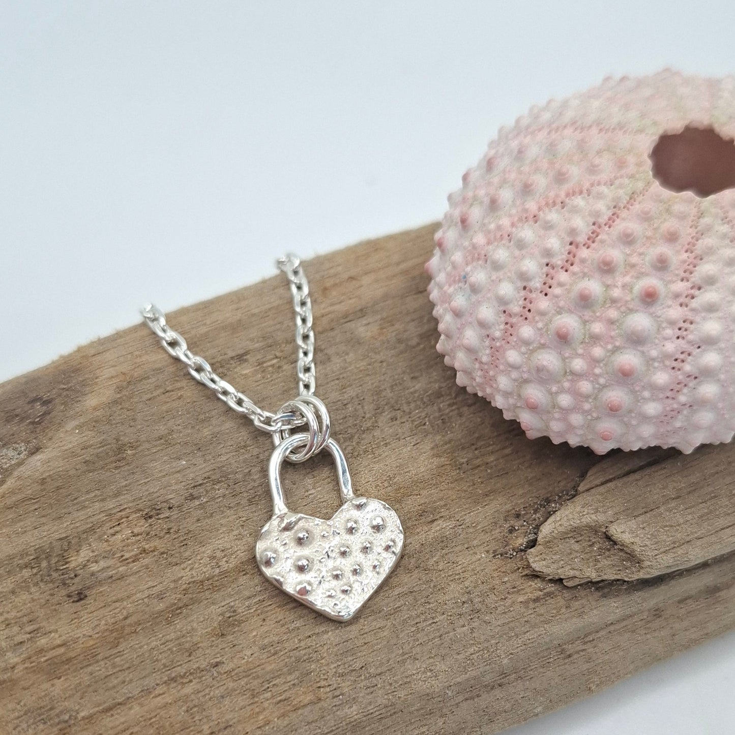 Silver sea urchin shell heart padlock style pendant | Ocean-Inspired Handmade Jewellery