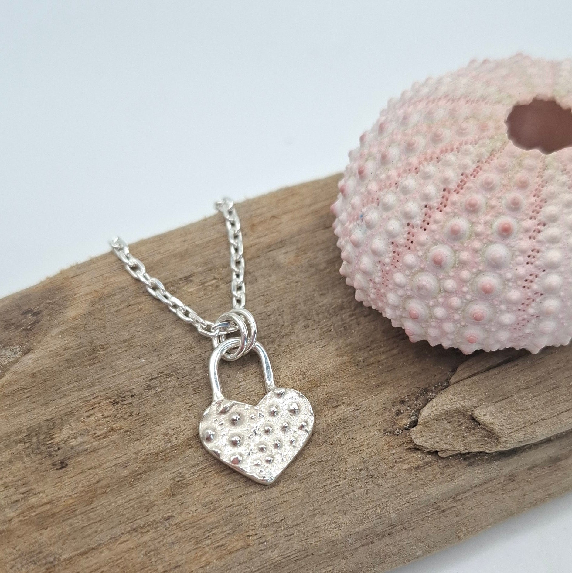 Silver sea urchin shell heart padlock style pendant | Ocean-Inspired Handmade Jewellery