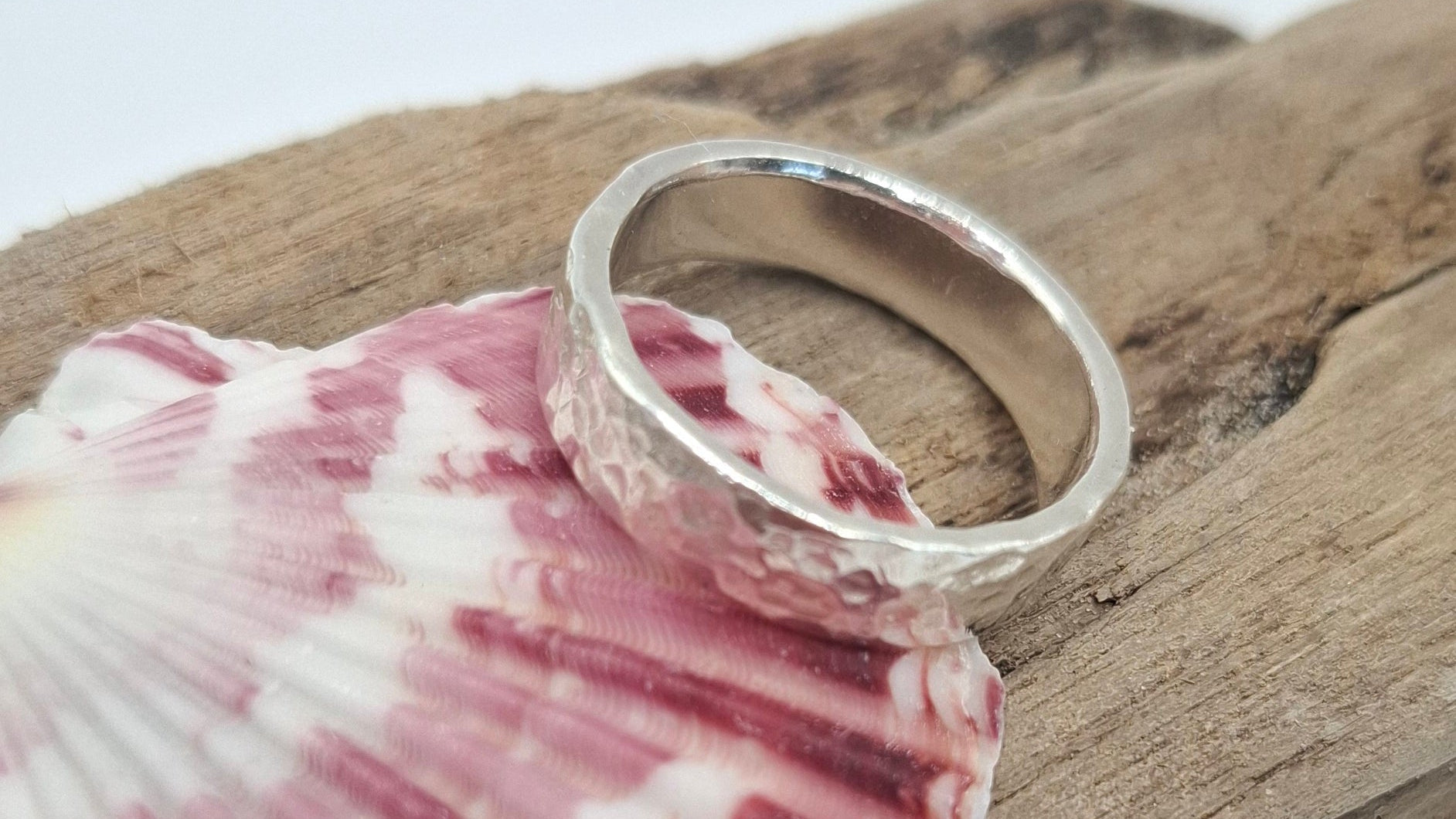 Hammered textured sterling silver ring by Shelley Ide Jewellery, showcasing a handcrafted, shiny band with a unique hammered finish.