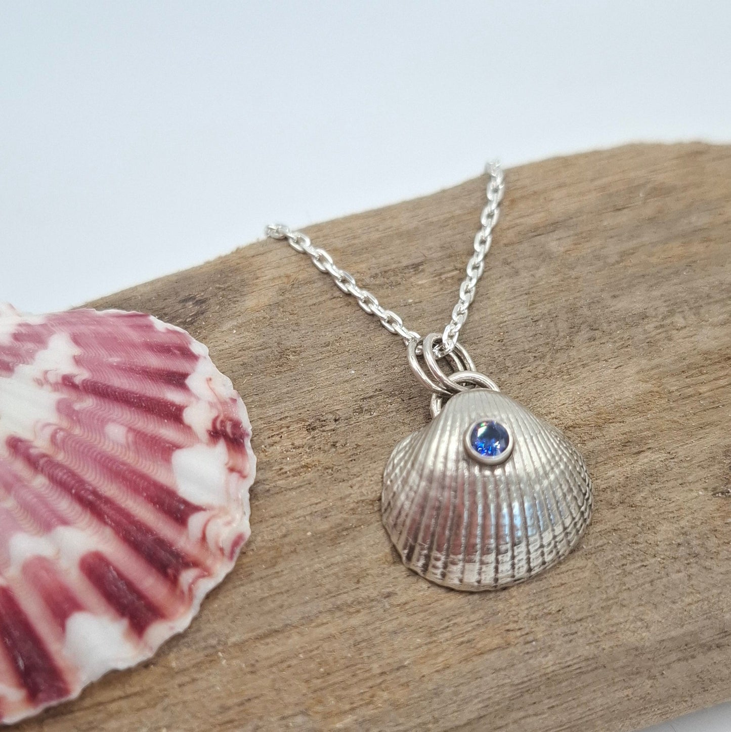 Silver cockle Shell with tanzanite blue cubic zirconia | Ocean-Inspired Handmade Jewellery - Shelley Ide Jewellery