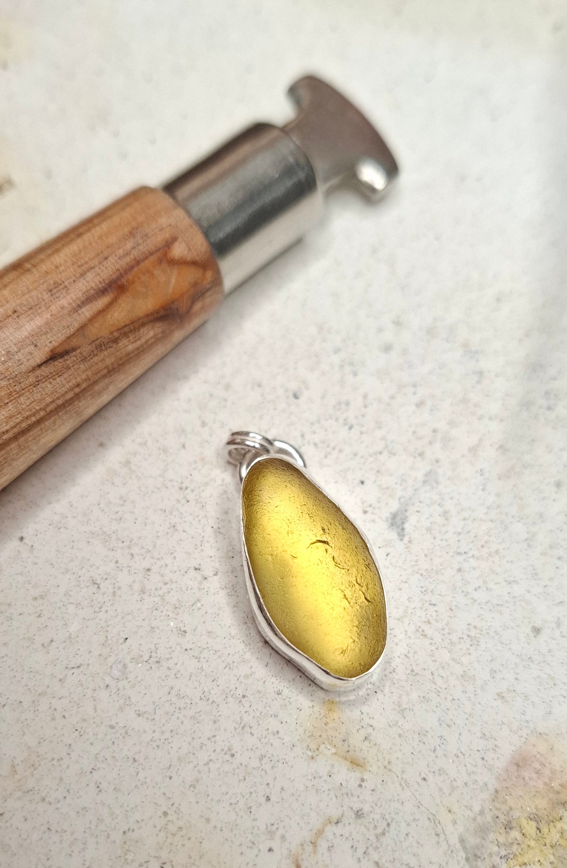 Large Channel Islands yellow seaglass pendant on a necklace, crafted by Shelley Ide Jewellery, featuring a smooth, vibrant seaglass piece.
