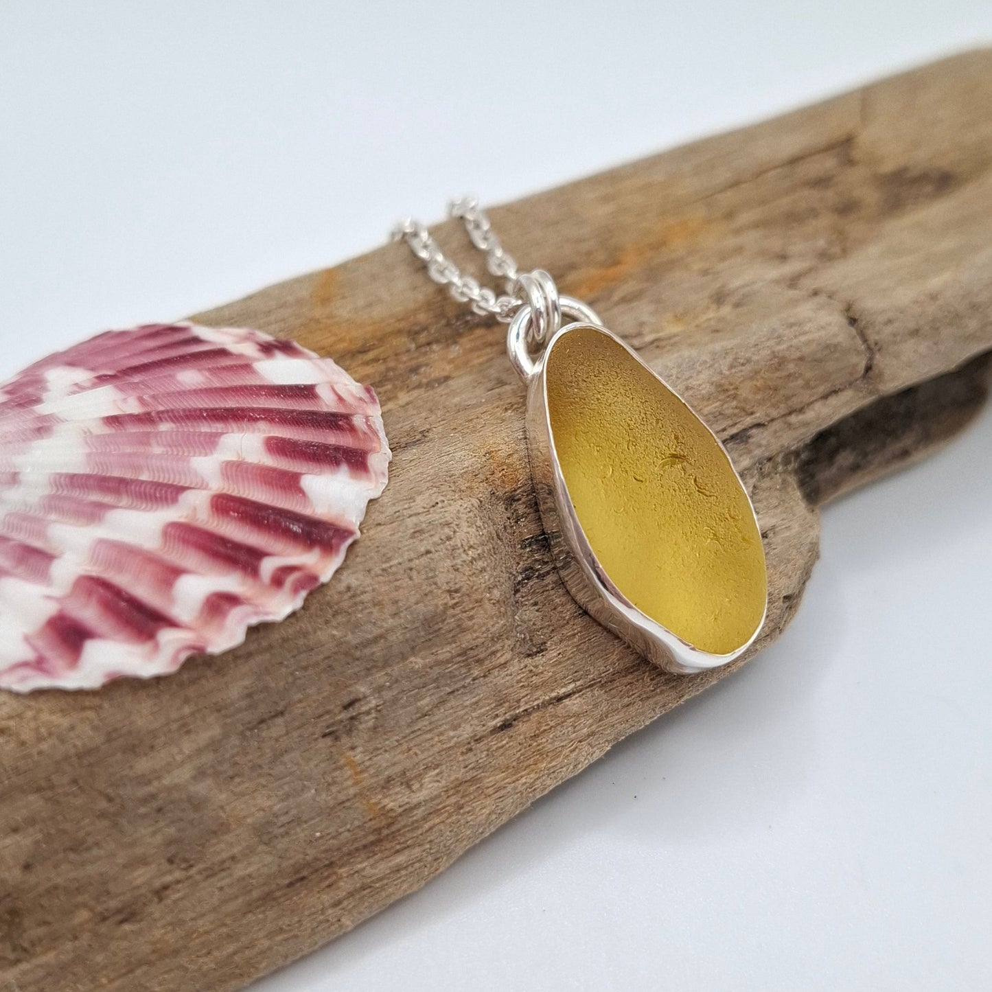 Large Channel Islands yellow seaglass pendant on a necklace, crafted by Shelley Ide Jewellery, showcasing a unique maritime-inspired design.