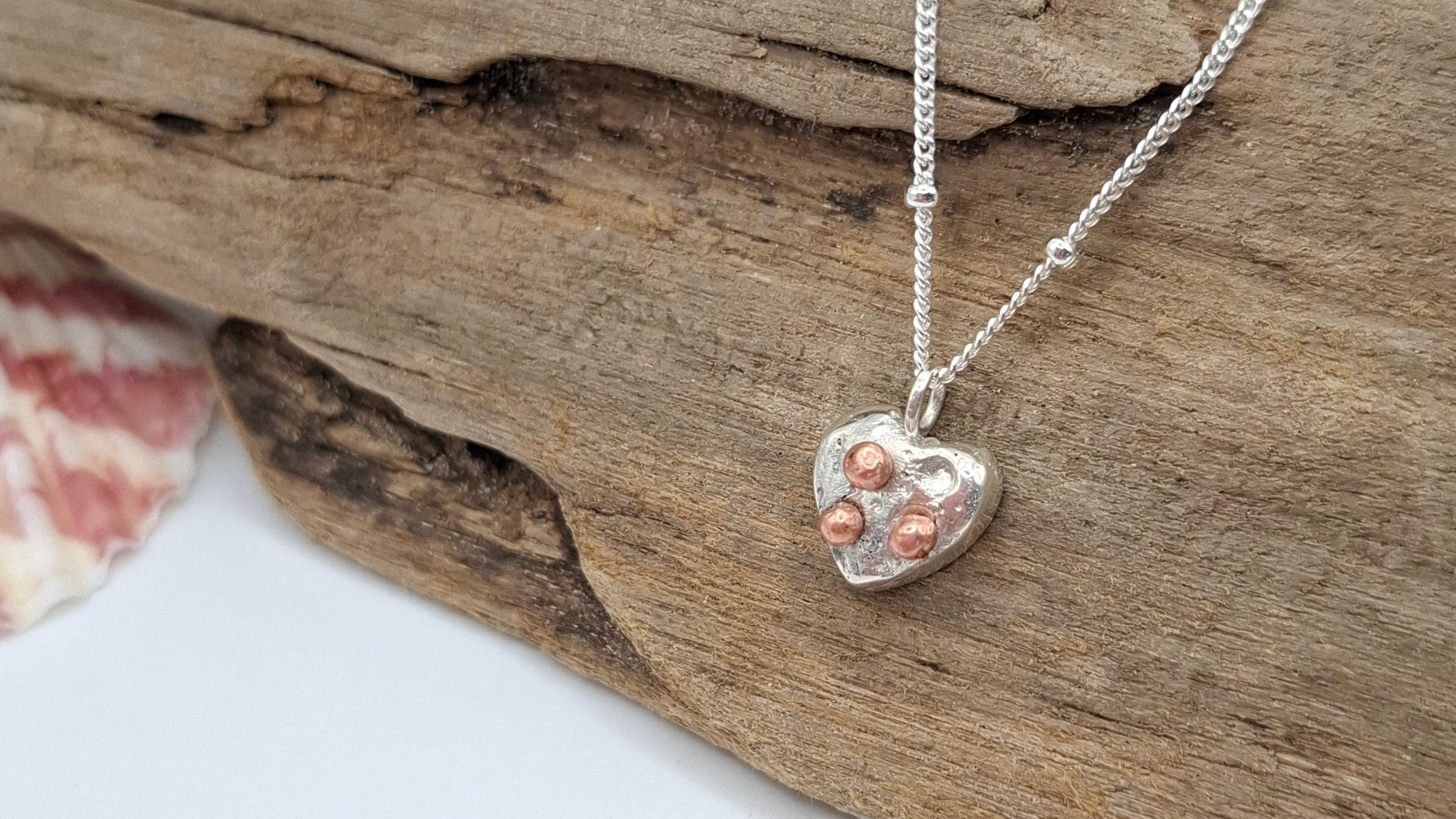 Silver and copper pendant workshop by Shelley Ide Jewellery showing tools and materials for jewelry making.