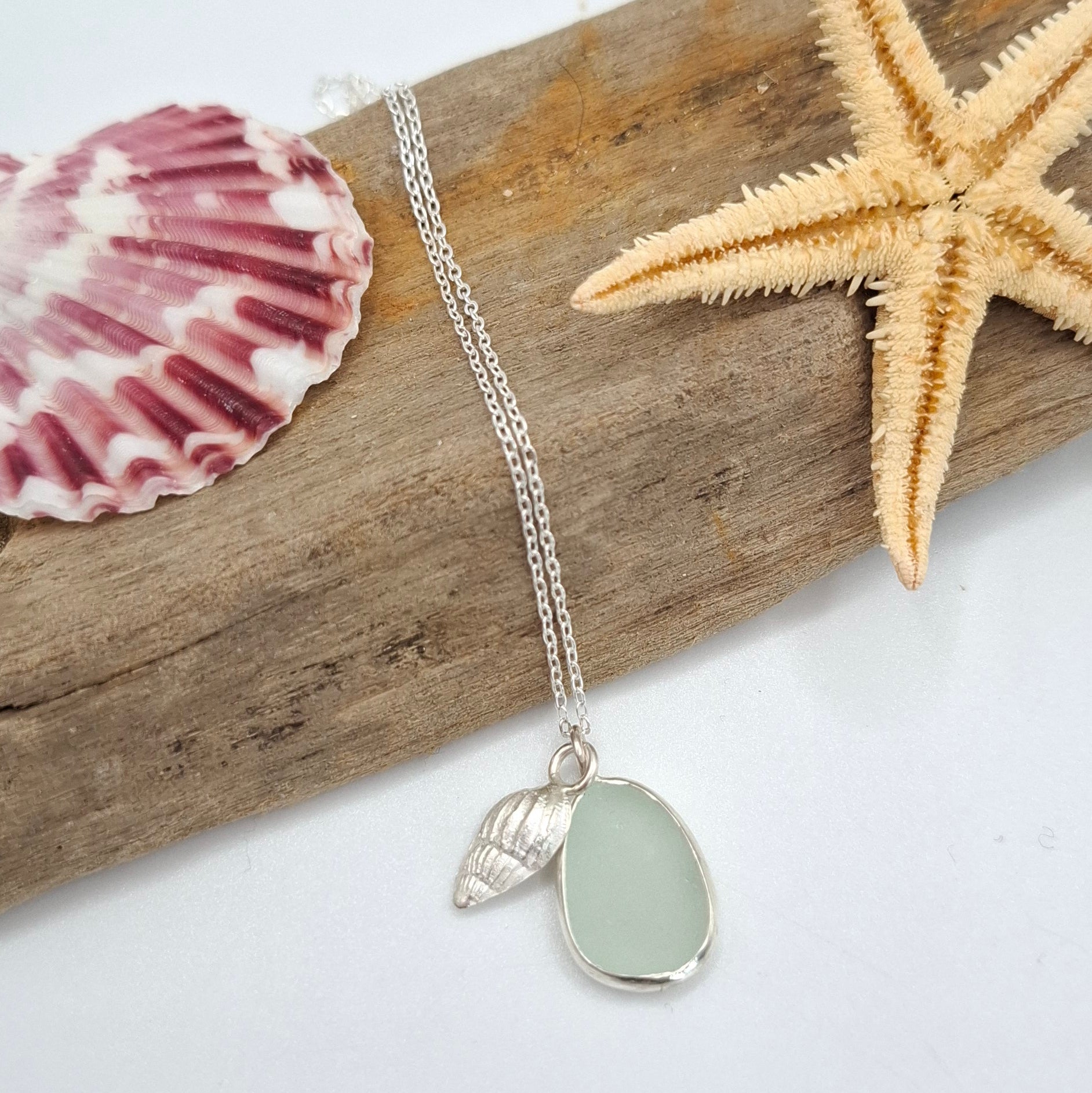 Light aqua blue seaglass pendant from Shelley Ide Jewellery, elegant necklace with a smooth, polished ocean-inspired design.