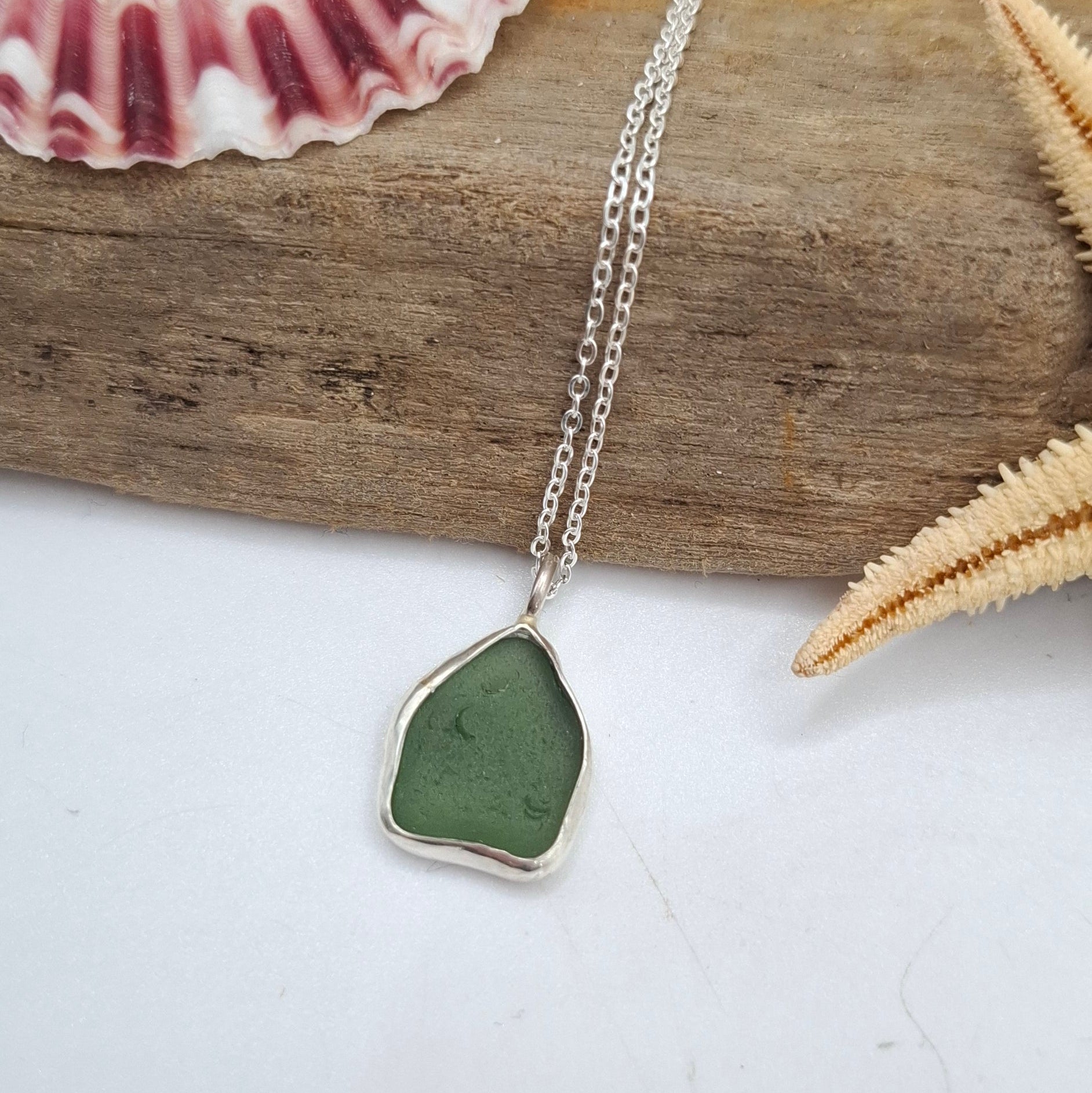 Bright green seaglass pendant necklace by Shelley Ide Jewellery, featuring a smooth, polished seaglass stone on a delicate chain.