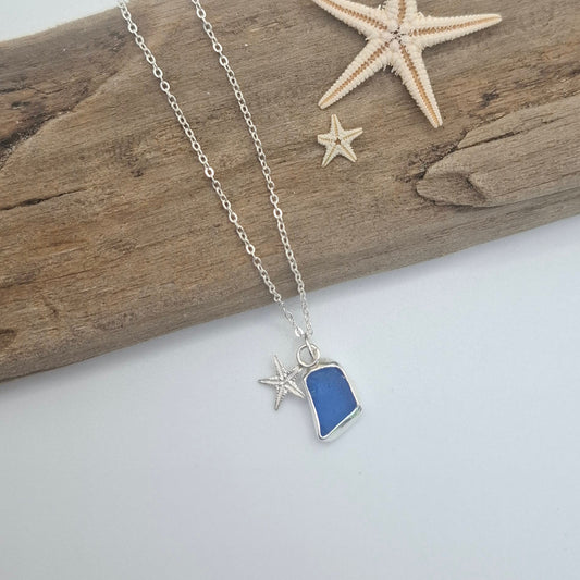 Small royal blue seaglass pendant with silver starfish charm on necklace, by Shelley Ide Jewellery, perfect for ocean-inspired jewelry.